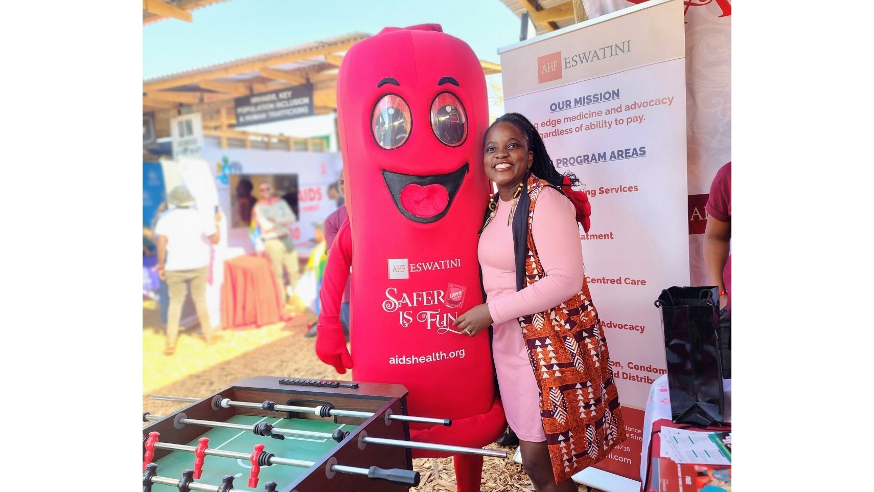 Spreading the message with a smile – AHF Eswatini’s mascot promoting safer sex during a community outreach event.